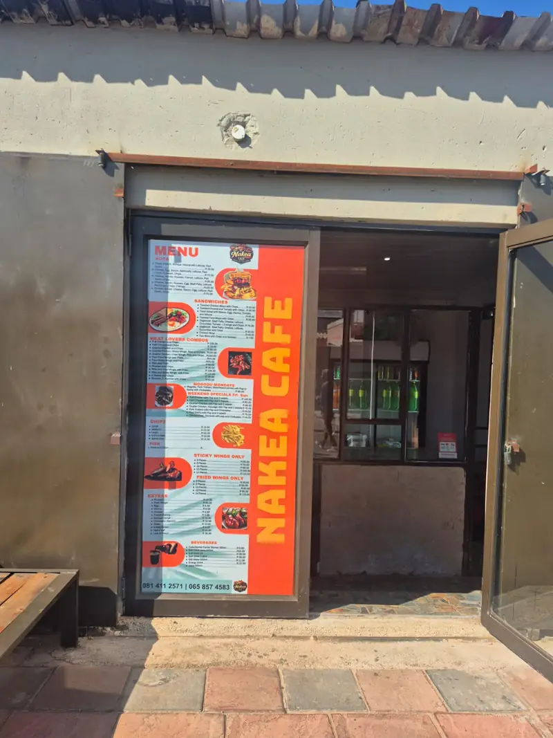 Nakea Cafe storefront with its orange menu board